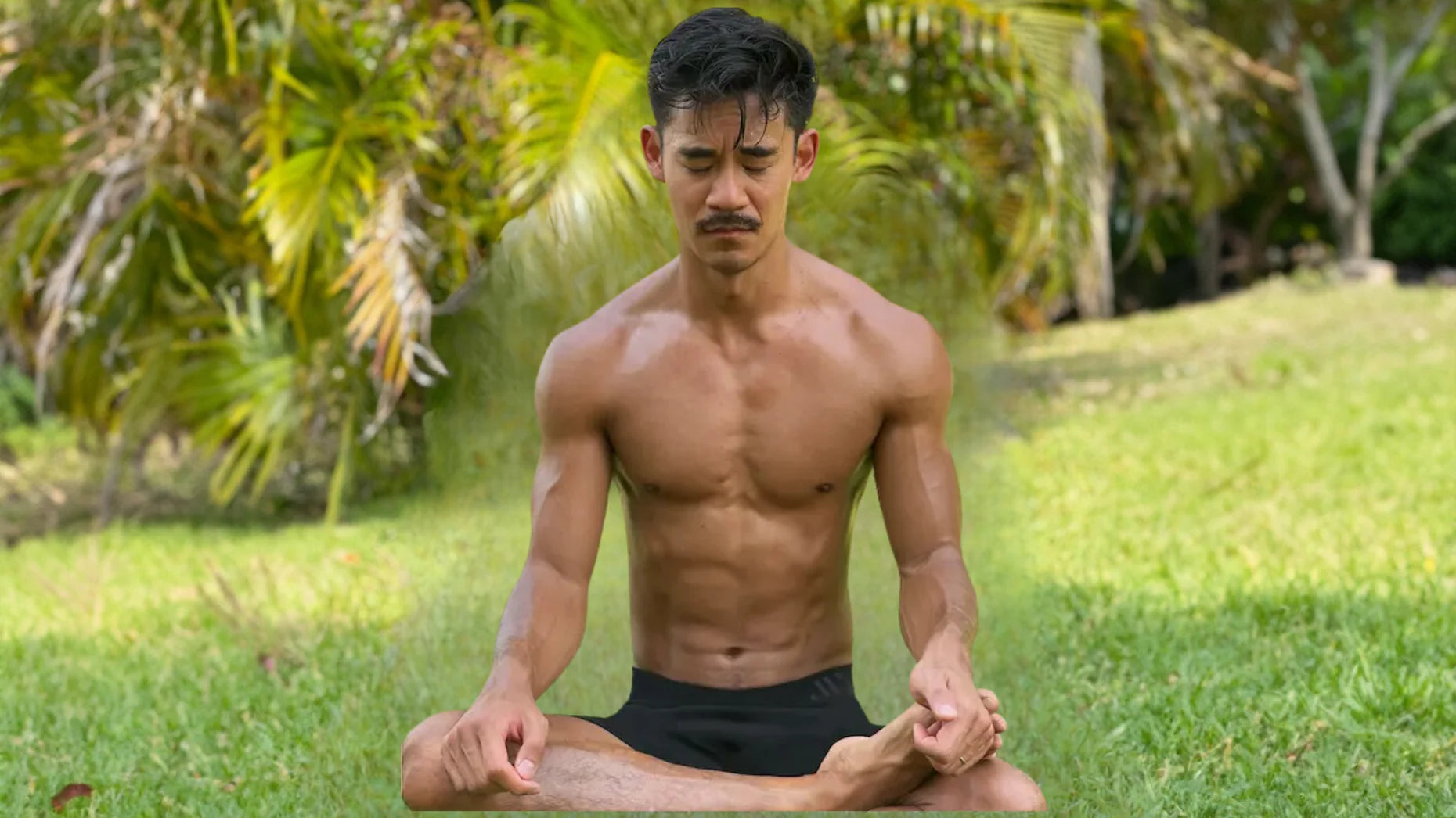 Shirtless man meditating in a peaceful outdoor setting, wearing black ALPHX boxer briefs, surrounded by tropical greenery—representing calm, confidence, and peace of mind for ALPHX’s hassle-free shipping and returns.