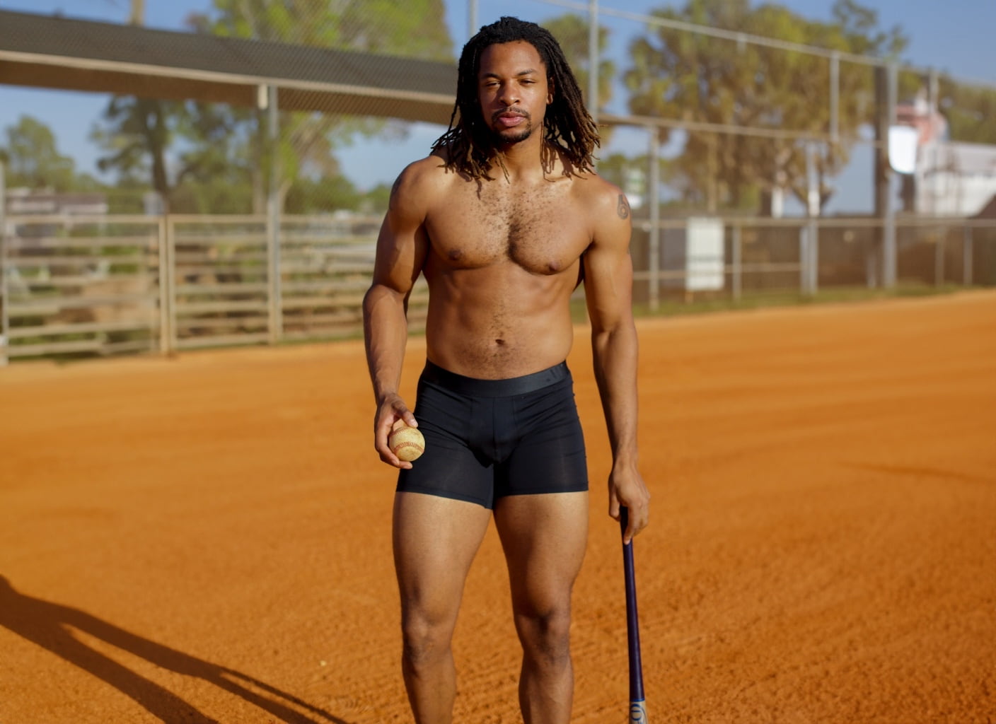 ALPHX-Man wearing Athletic Fit Black Boxer Briefs on baseball diamond