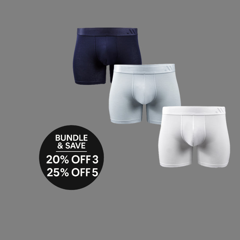 Three pairs of men's underwear in black, gray, and white on a gray background with promotional text.