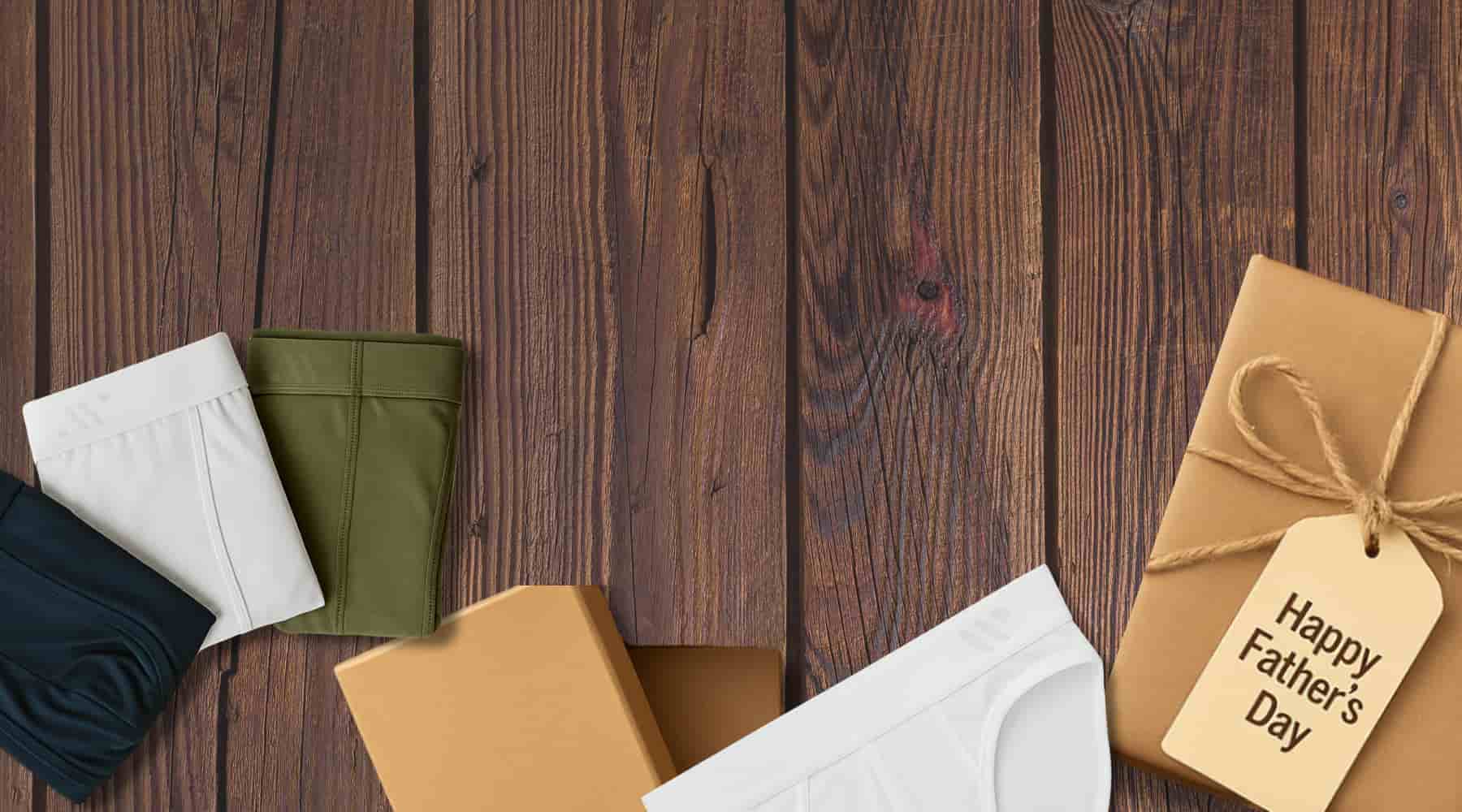 Flat lay of ALPHX boxer briefs gift set with watch, phone, and wallet – perfect 30% off gift for Father's Day
