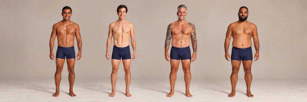 Four men standing side by side wearing ALPHX Athletic Fit Boxer Briefs, one for each size from S to XL, showing how each waist size fits different body types
