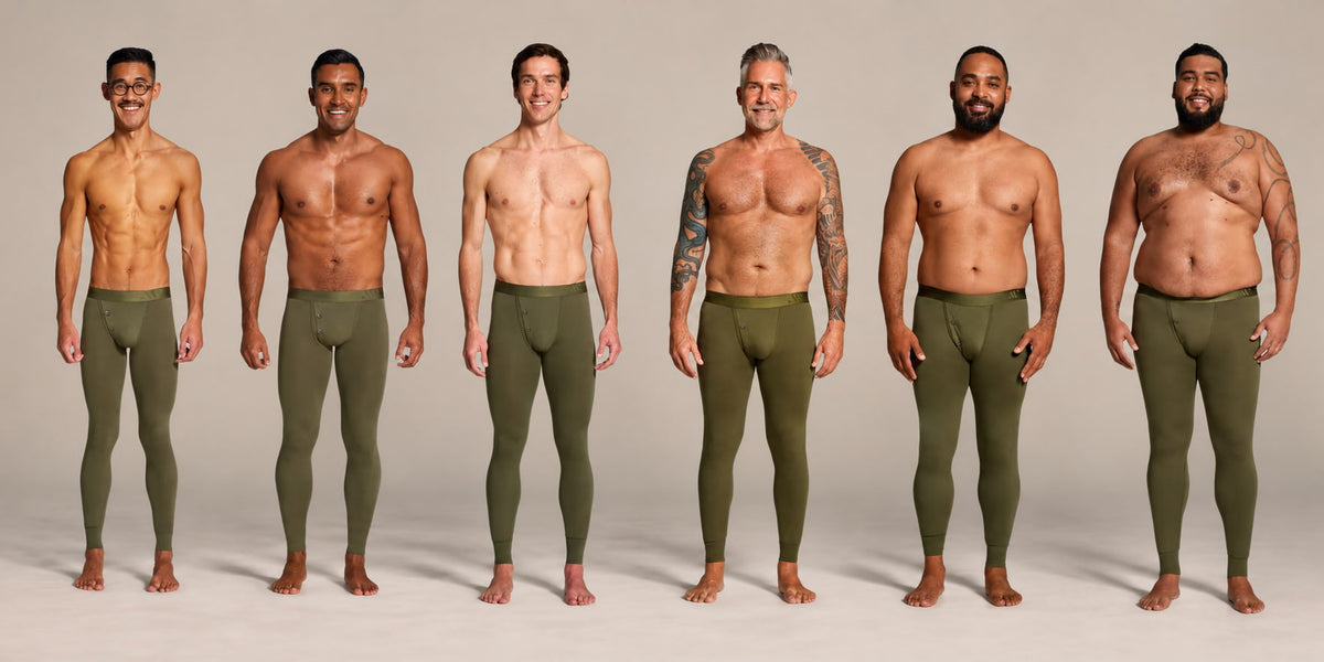 Six men standing side by side wearing ALPHX Modern Fit Union Pants, one for each size from XS to 2XL, showing how each waist size fits different body types